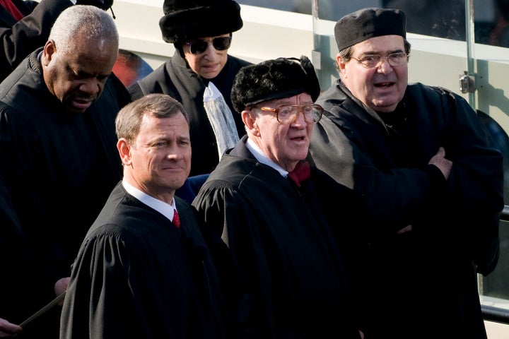 Stevens (center) attends the inauguration of President Barack Obama in 2009. Standing around him (clockwise from his immediate left) are Chief Justice John Roberts and Justices Clarence Thomas, Ruth Bader Ginsburg and Antonin Scalia.