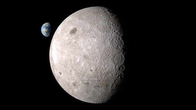 Far side of the moon with Earth in the background.