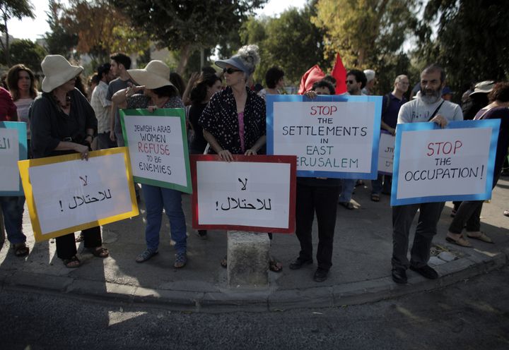 Palestinian, Israeli and foreign activists demonstrate against evictions in Sheikh Jarrah in September 2015. El-Kurd realized as he grew up that his family's situation was not unique.