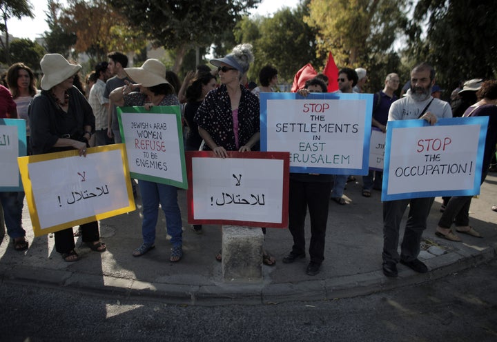 Palestinian, Israeli and foreign activists demonstrate against evictions in Sheikh Jarrah in September 2015. El-Kurd realized as he grew up that his family's situation was not unique.