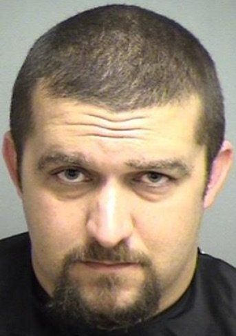 Evan Patrick Cater, 31, was allegedly found drunk and face down in a neighbor's yard with a gun and what a local newspaper called "suspicious bacon."
