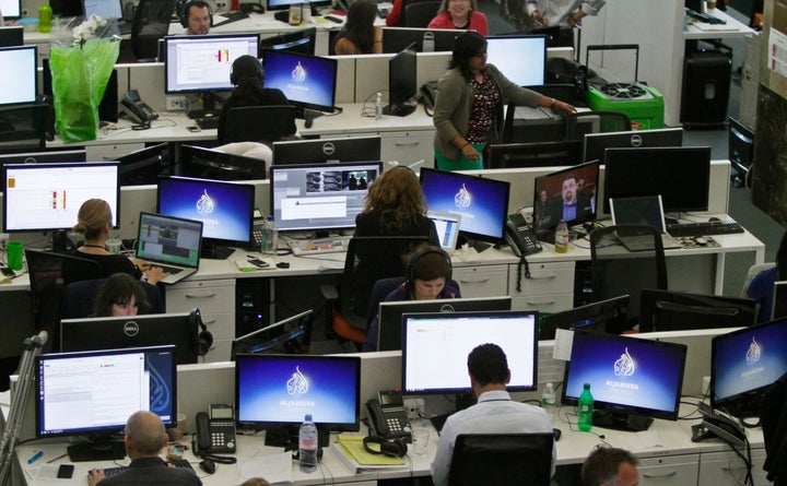 Al Jazeera America editorial newsroom staff prepare for their first broadcast on Tuesday, Aug. 20, 2013 in New York.