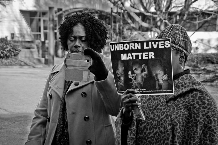 Protestors hold up an "Unborn Lives Matter" sign in Raleigh, North Carolina. 