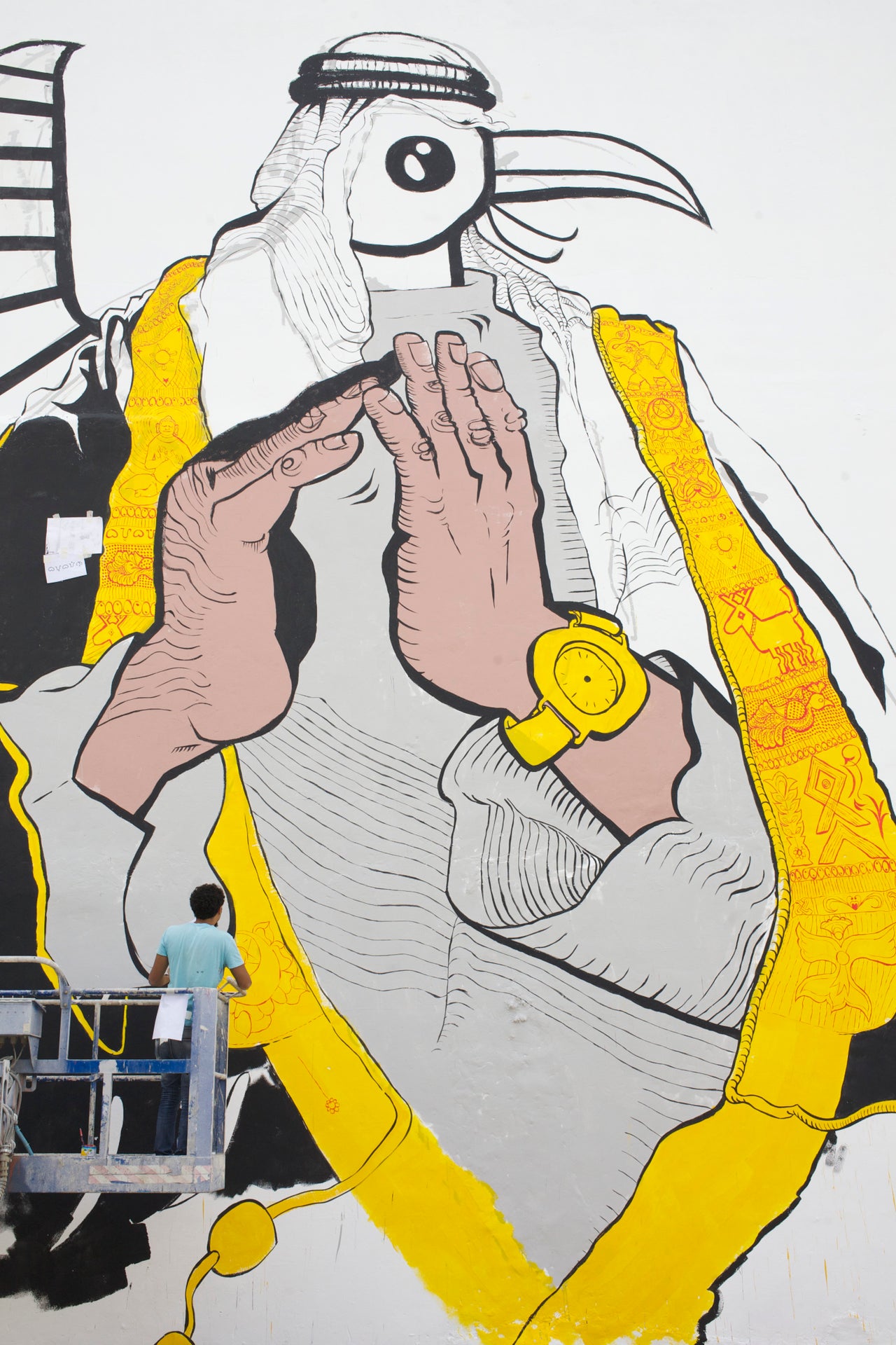 Ganzeer is known for his murals that blend current cultural images with traditional symbols, such as the one pictured here in Bahrain in 2014.