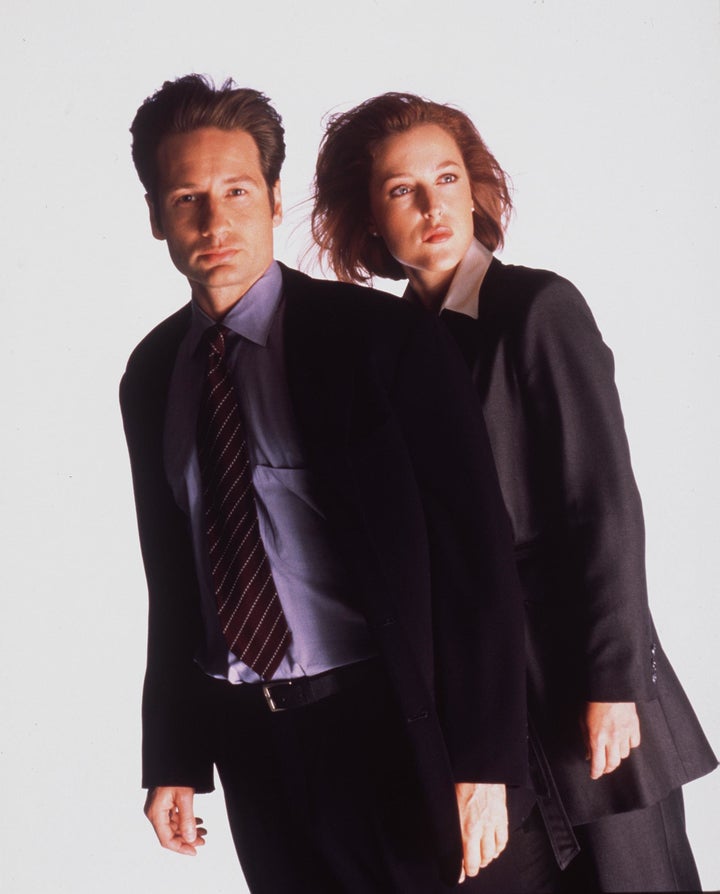 David Duchovny and Gillian Anderson pose for an "X-Files" promo in 1999.