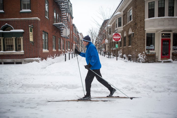 A man skies through downtown Philadelphia as snow continues to fall on Jan. 23, 2016 in Philadelphia, Pennsylvania.