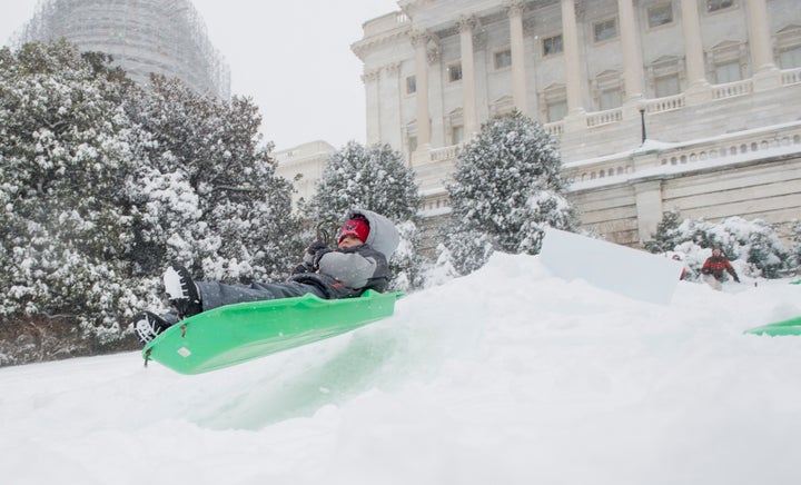 Sledders took to the slopes of the West Front of the Capitol on Saturday morning, Jan. 23, 2016 in Washington, DC.