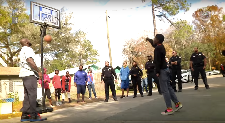 The hulking All-Star athlete challenged the kids with free throw shots.