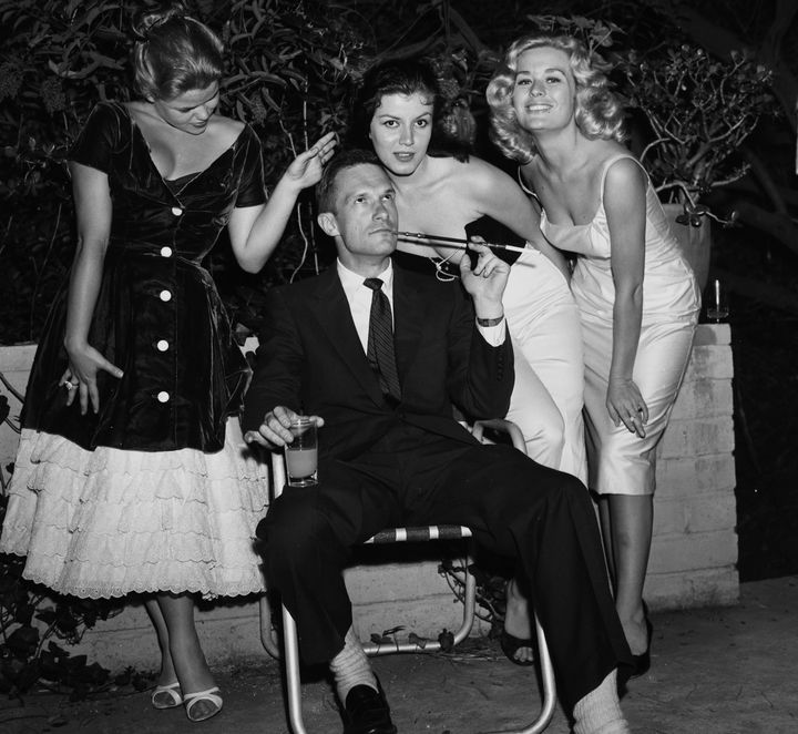 Hugh Hefner with Sylvia Sidney, Joan Bradshaw and Caroline Mitchell at a Playboy party in Los Angeles on June 26, 1957.