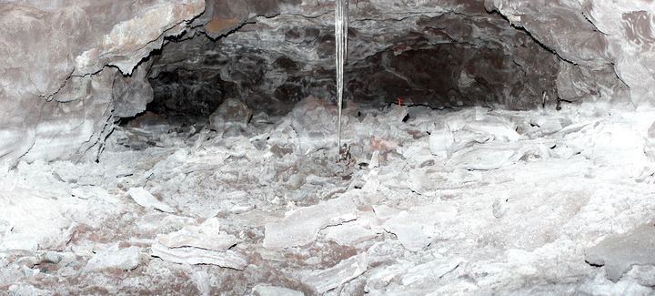 The white floor and white lower part of the walls is where ice used to be in the Mauna Loa Ice Cave.