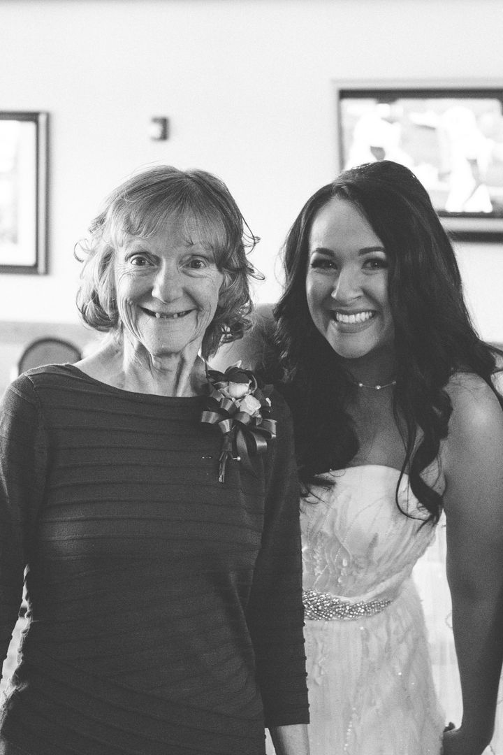 Julia Napolitano (right) poses with her mother, LInda, on her wedding day. Because Linda, 66, has advanced stages of Alzheimer's disease, attending the ceremony was not an option. So Napolitano and groom Justin Phillips held a special ceremony at the assisted living facility where her mother resides.