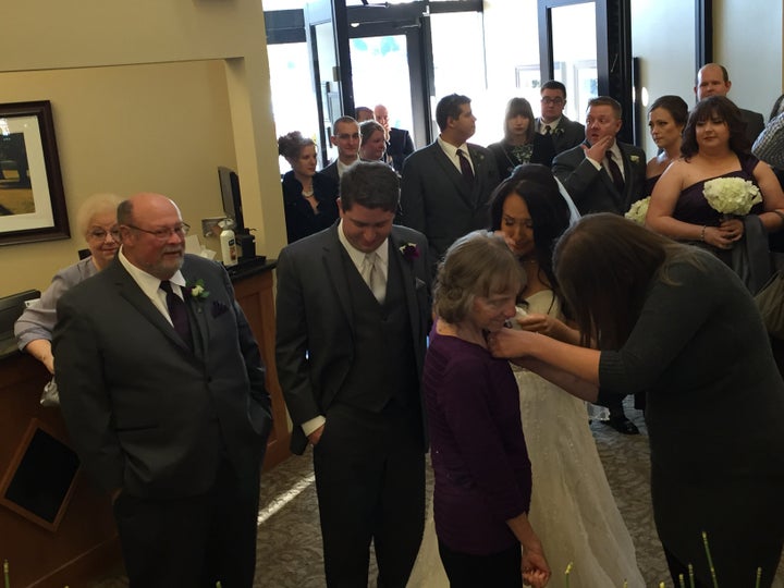 Julia Napolitano gives her mother, Linda, a wedding corsage.