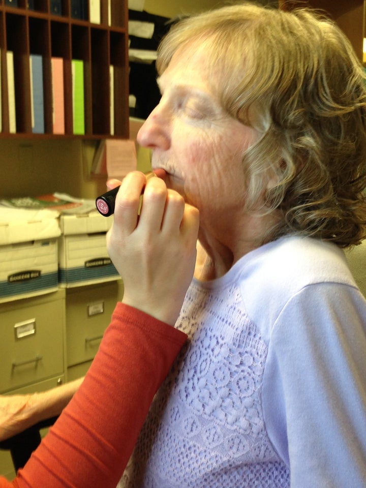 Linda Napolitano gets made up before her daughter's wedding reception.