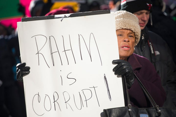 Demonstrators calling for an end to gun violence and the resignation of Chicago Mayor Rahm Emanuel march through downtown on December 31, 2015 in Chicago, Illinois.