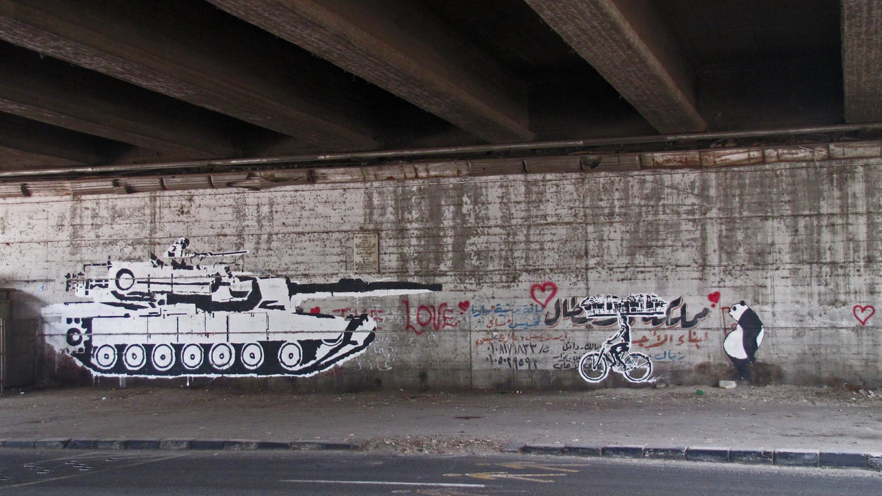 "Tank Vs Biker," one of Ganzeer's first murals during the 2011 protests. The artist wanted to "create awareness about the malpractices of Egypt's Supreme Council of the Armed Forces," he said.