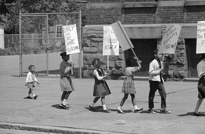 A civil rights demonstration in 1964 commemorates Brown v. Board of Education. 