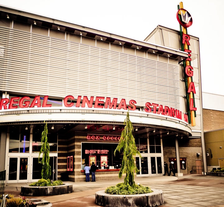 A 29-year-old man was charged over the weekend after police say he brought a gun into this movie theater and accidentally shot a woman.