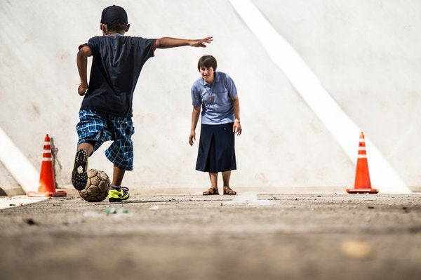 Miranda photographed the children as they played among themselves and with the chapel's nuns.