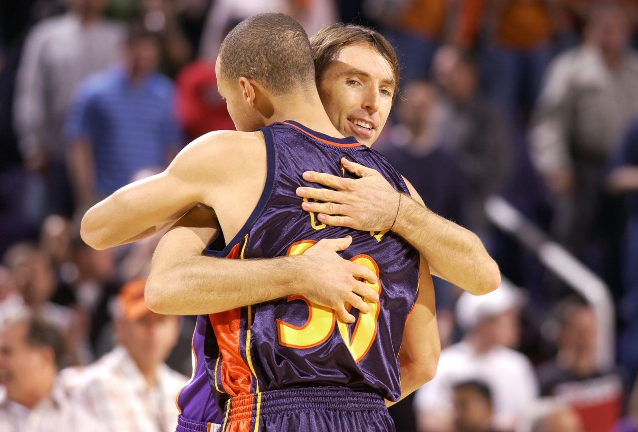 Nash greets a rookie Stephen Curry after the Suns defeated the Warriors, 123-101, on Oct. 30, 2009, in Phoenix, Arizona.