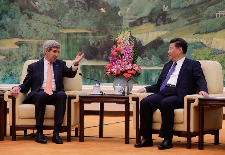 Kerry, pictured here with Chinese President Xi Jinping, also stressed the need to ease South China Sea tensions.