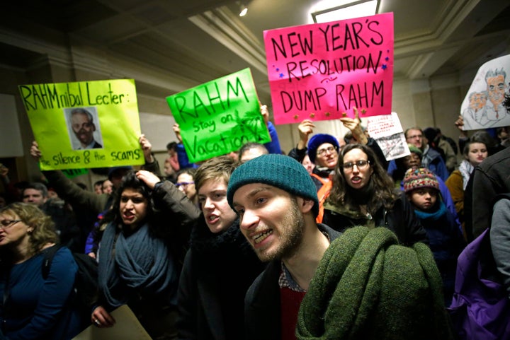 Demonstrators protest recent Chicago police shootings against local residents outside Mayor Rahm Emanuel's office at City Hall on Dec. 31, 2015.