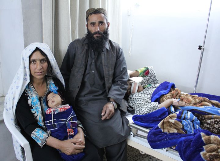 Reza, her mother, baby sister and brother-in-law sit in her hospital room in Mazar-e-Sharif on Wednesday.