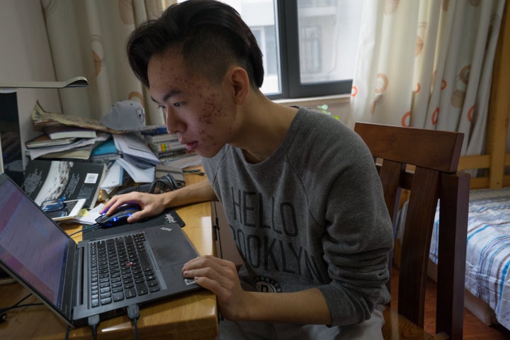 Frank sits in his room after finishing his last applications to U.S. colleges.