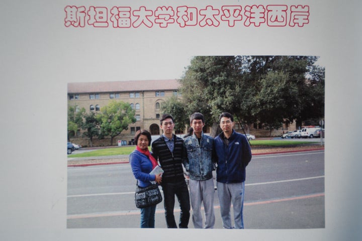 A page from a scrapbook shows the family outside the Stanford political science building.