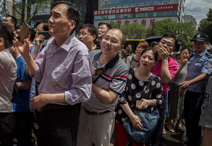 Parents of Chinese students wait for their children to finish the gaokao on June 7, 2015 in Beijing, China.