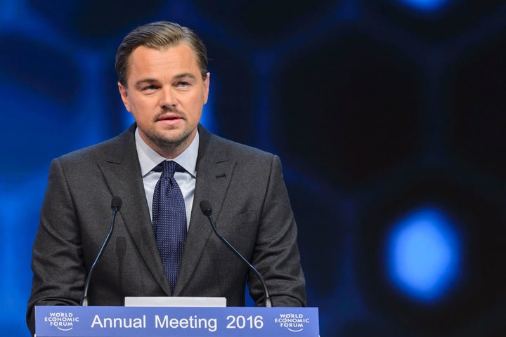 Leonardo DiCaprio delivers a speech after he was awarded during the 22nd Annual Crystal Awards at the opening of the World Ec