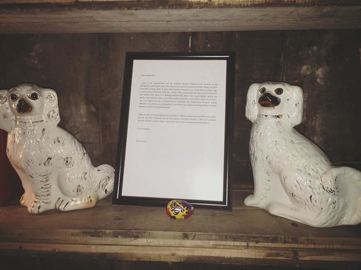 The beloved porcelain dogs, Cederick and Cecil, alongside the perfect apology letter. 