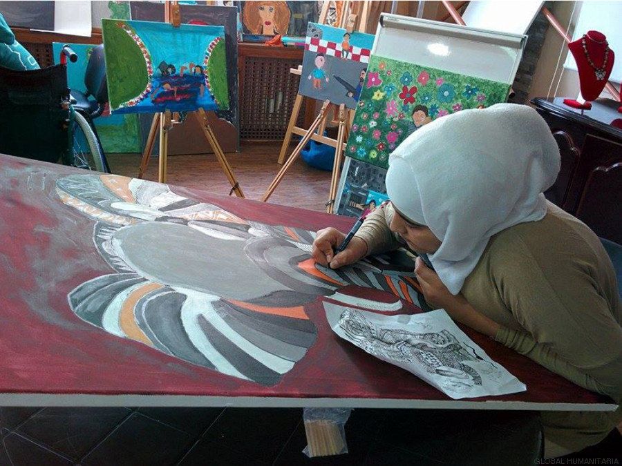 Iman is 15 years old. A bomb exploded near the car she was in with her family. Two of her brothers died. She lost one of her legs. In the image above, she is working on a painting called "Sharing the Grief: I Need Someone to Share my Pain."