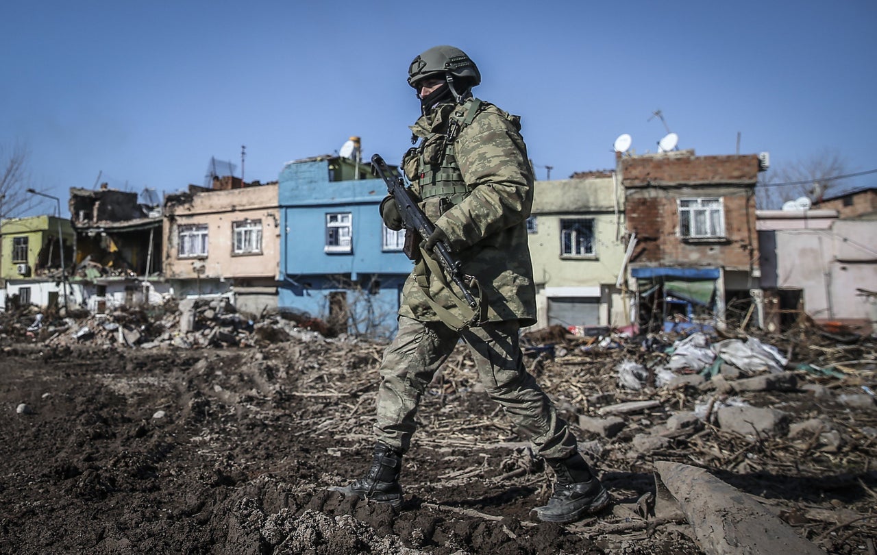 A Turkish soldier patrols Sur, southeast Turkey. The fighting ended two years of ceasefire between the country and the Kurdistan Workers Party.