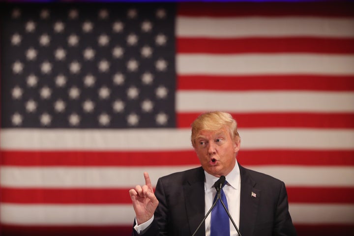 Republican presidential candidate Donald Trump gestures as he speaks to veterans at Drake University on January 28, 2016 in Des Moines, Iowa.