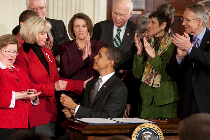 President Barack Obama signs the Lilly Ledbetter Fair Pay Act in 2009, a measure that Supreme Court Justice Ruth Bader Ginsburg had pushed for.