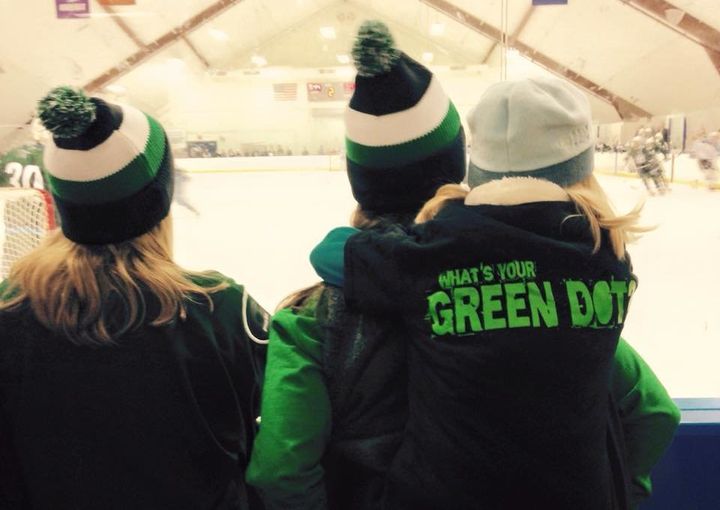 Fans watch the annual Connecticut College Green Dot-themed hockey game.