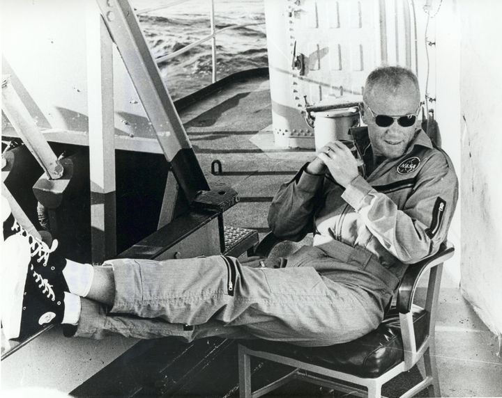Glenn relaxes on the deck of the USS Noa after his historic space flight.