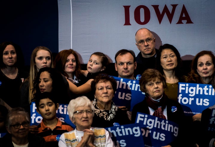 Iowa voters listen to former Secretary of State Hillary Clinton speak at a campaign event in Dubuque, Iowa on Friday, January