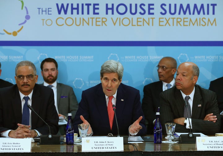 Secretary of State John Kerry, former Attorney General Eric Holder and Homeland Security Secretary Jeh Johnson speak at the W