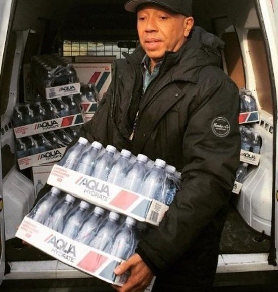 Russell Simmons teams up with AQUAhydrate to donate water to Flint residents on February 1. Simmons donated 150,000 bottles of water to Flint as part of Sean “Diddy” Combs and Mark Wahlberg’s one million bottle pledge.