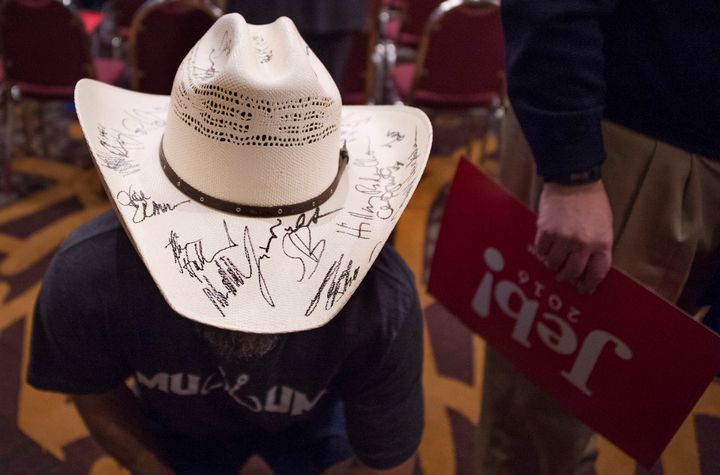 John Hathaway shows his hat that has been signed by all the candidates for president during a campaign event for Republican presidential candidate Jeb Bush in Des Moines, Iowa, on Monday ahead of the Iowa Caucus.