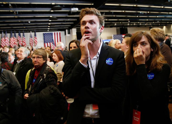 Supporters watch as results are displayed on a television during the caucus night event of Democratic presidential candidate former Secretary of State Hillary Clinton in the Olmsted Center at Drake University on Feb. 1, 2016 in Des Moines, Iowa.
