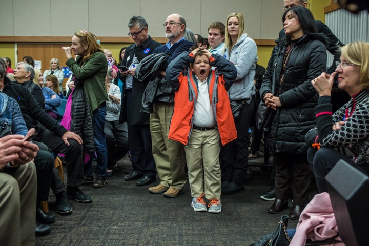 Federico Oliphant, age 8, yawns during the Democratic party caucus in precinct 317 at Valley Church on Feb. 1, 2016 in West Des Moines, Iowa.