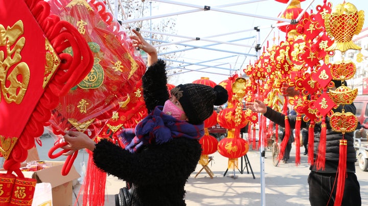 People purchase New Year's decorations in Zoucheng City, in east China's Shandong province.