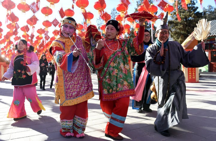 Folk artists rehearse for a upcoming temple fair to celebrate the Chinese Lunar New Year.