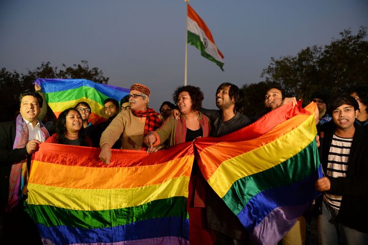 Indian gay rights activists celebrate after the country's Supreme Court agreed to review a decision which criminalises gay sex in New Delhi. 