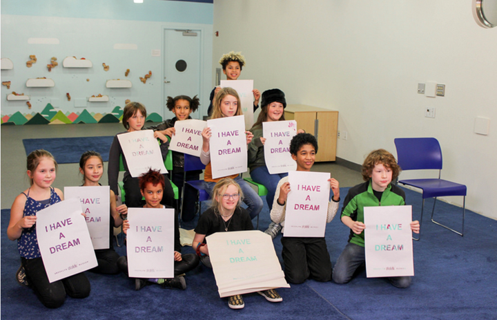 The #HatchKids hold up signs that read "I Have A Dream"