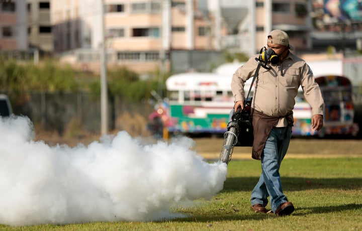 A worker fumigates for Aedes aegypti mosquitoes where carnival celebrations will be held in Panama City. Authorities announced on Monday that 50 cases of the Zika virus infection have been detected in Panama's sparsely populated Guna Yala indigenous area along the Caribbean coast.