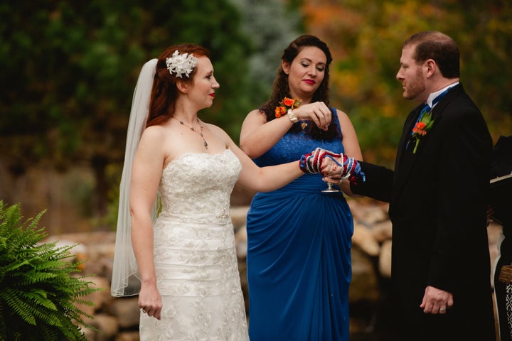 Courtney Weber's bridesmaid Tiffany Spaulding, blesses the union with water "for energies of love," Weber said. "The water came from a Holy Well in Ireland."