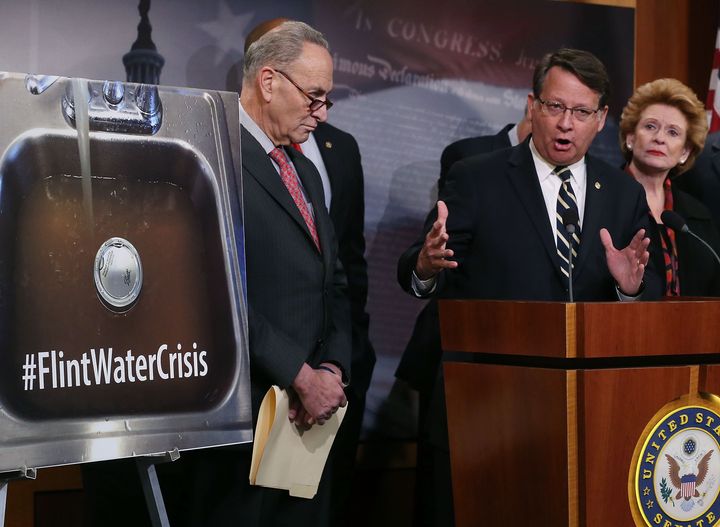 Flint's water crisis is finally in the national spotlight. Rep. Gary Peters (D-MI), center, flanked by Sen. Debbie Stabenow (D-MI), and Sen. Chuck Schumer (D-N.Y.), discusses helping affected families, during a news conference on Capitol Hill, Jan. 28.